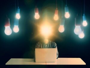 Creative concept image of a man with light bulb head surrounded by ideas, symbolizing business ideas in Nigeria with 50k